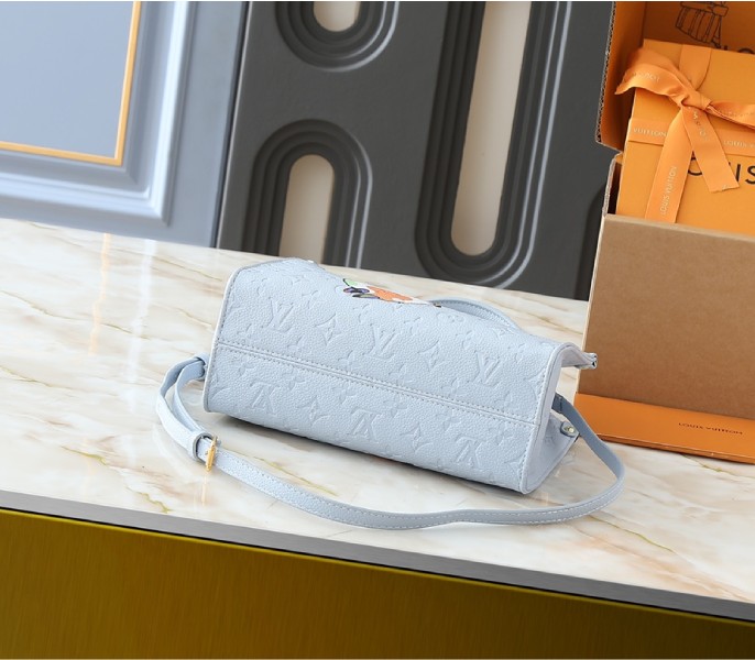 X TM Monogram Empreinte OnTheGo PM With Bijou Edition In Washed Blue - Image 4